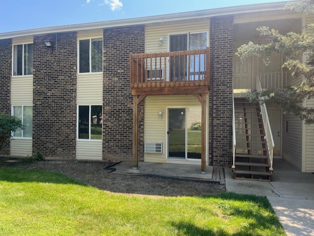 2300 Light Road, Unit 109 Oswego, IL 60543 - Photo 1 of 16 a view of a house with backyard garden and large tree