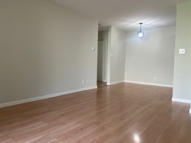 2300 Light Road, Unit 109 Oswego, IL 60543 - Photo 4 of 16 wooden floor in an empty room