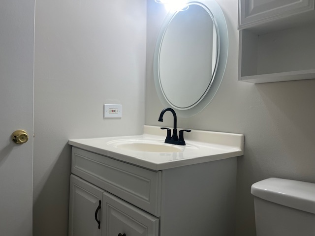 2300 Light Road, Unit 109 Oswego, IL 60543 - Photo 8 of 16 a bathroom with a sink and a toilet
