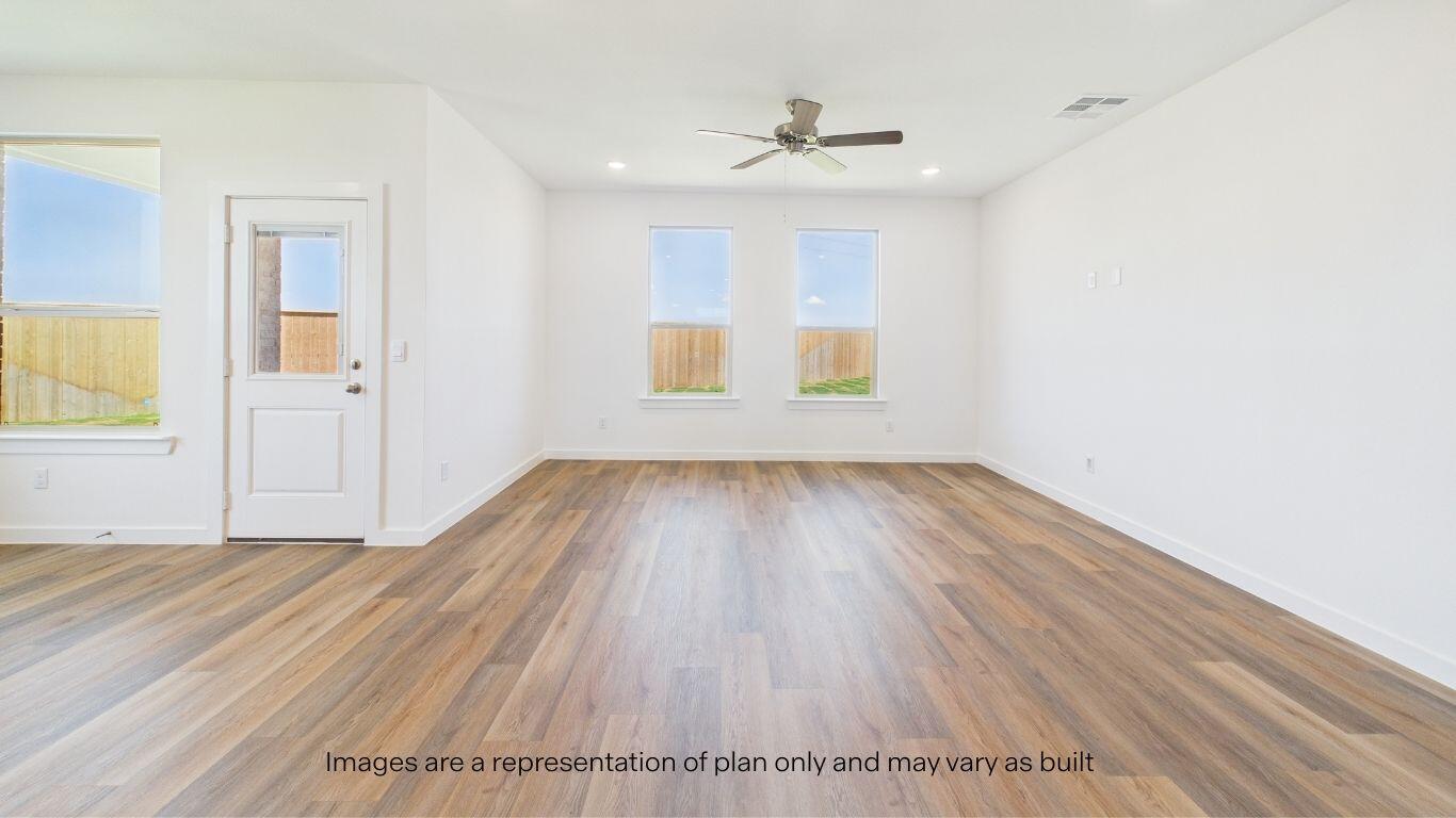 7010 53rd Street Lubbock, TX 79407 - Photo 15 of 33 a view of wooden floor and windows in a room