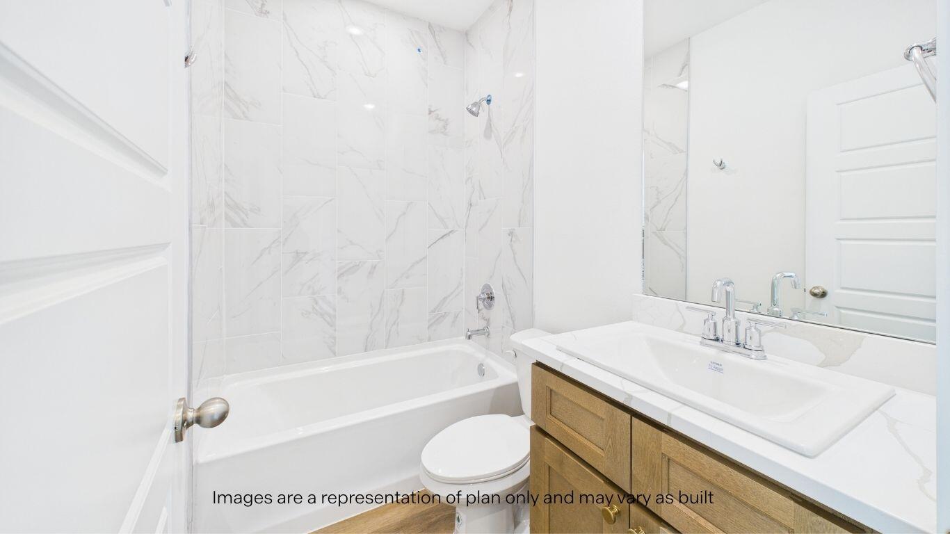 7010 53rd Street Lubbock, TX 79407 - Photo 6 of 33 a bathroom with a sink a toilet and a bathtub