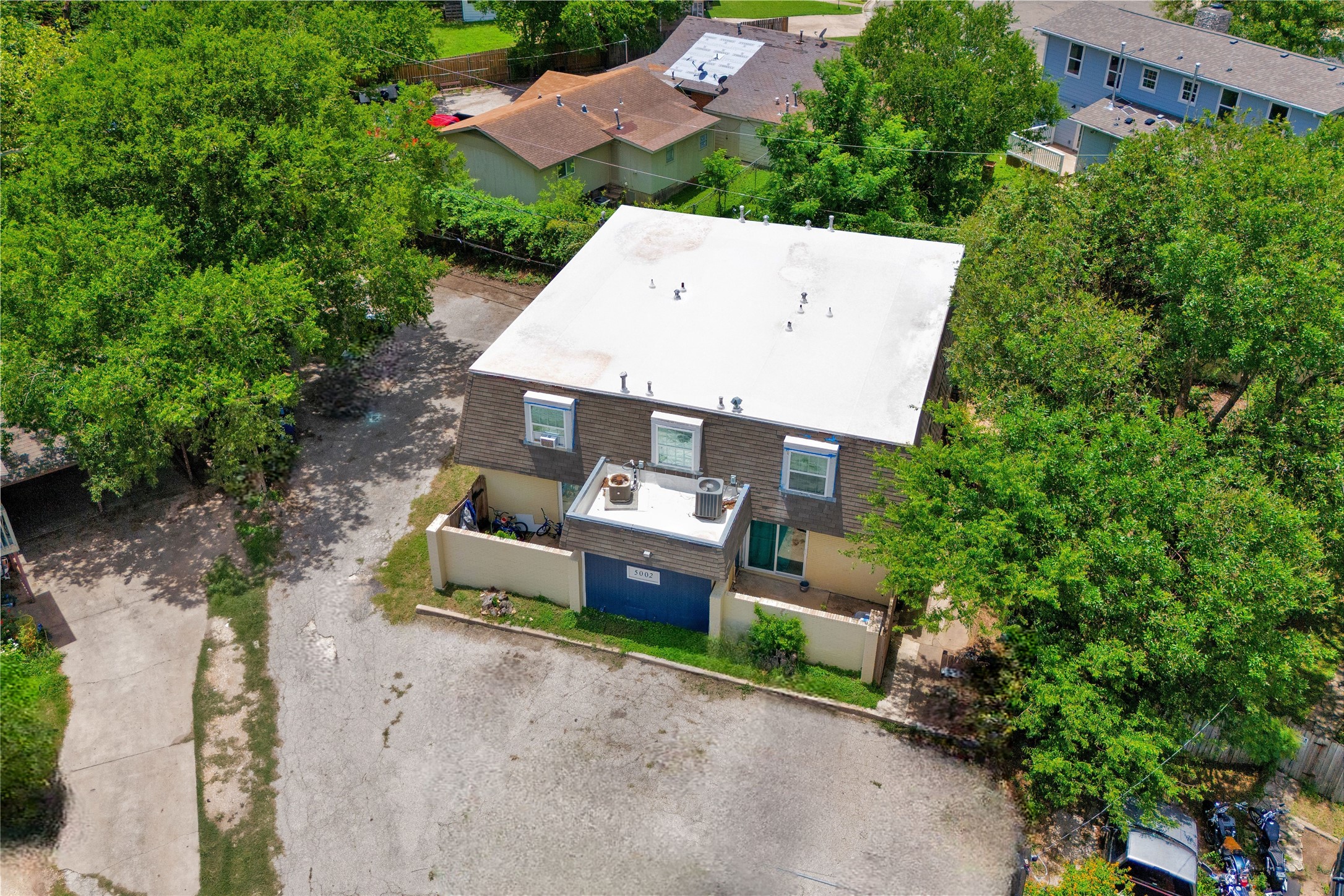 5002 Blue Spruce Circle, Unit C Austin, TX 78723 - Photo 3 of 18 an aerial view of a house with a yard