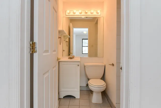 a bathroom with a toilet and a sink