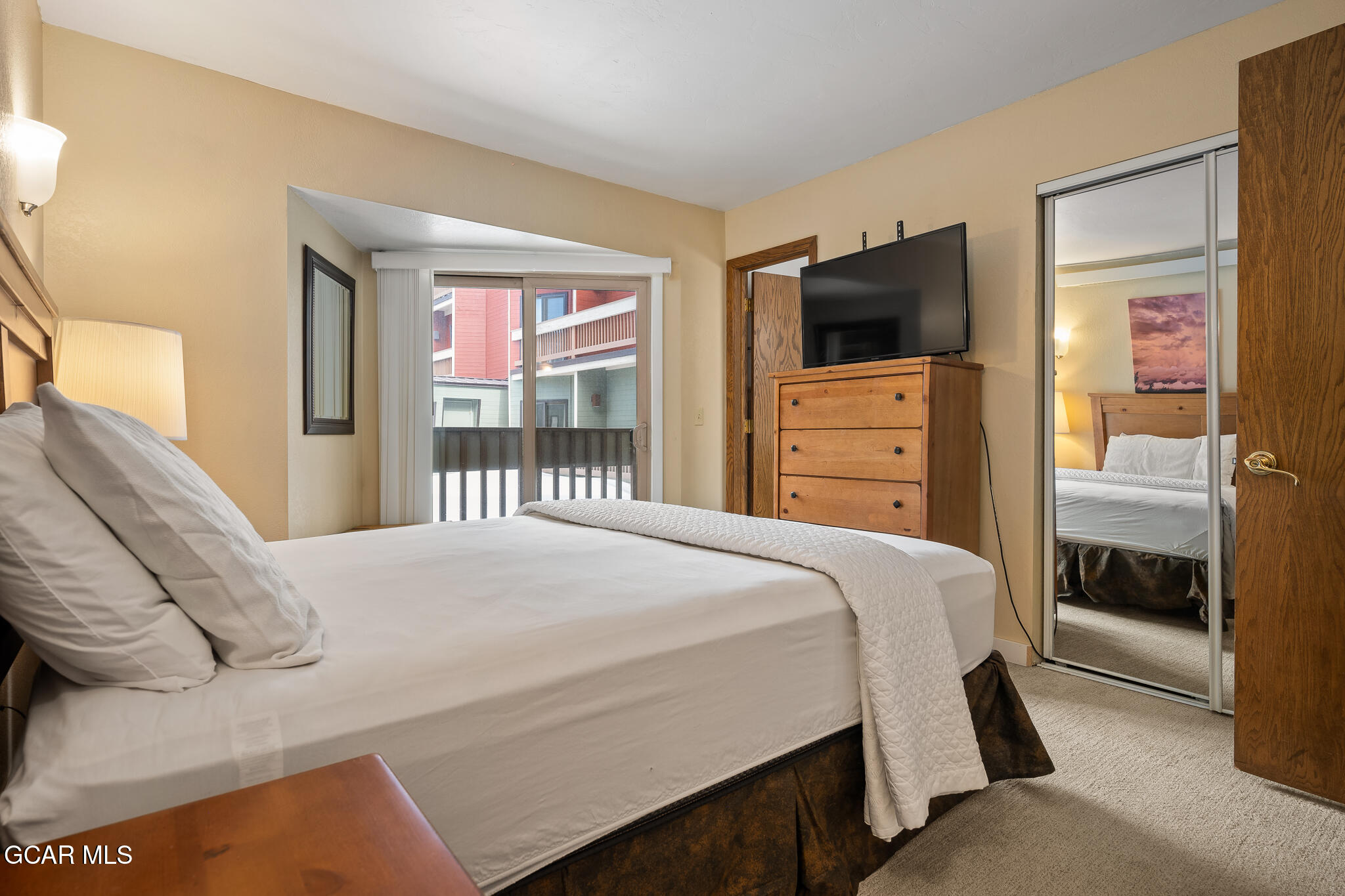 490 Kings Crossing Road, Unit 611 Winter Park, CO 80482 - Photo 21 of 39 a bedroom with a bed and a television
