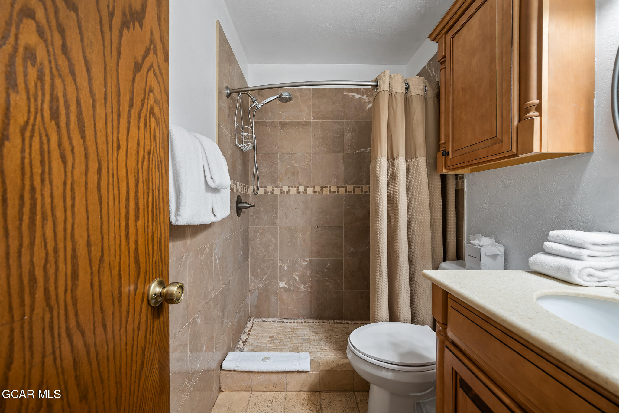 490 Kings Crossing Road, Unit 611 Winter Park, CO 80482 - Photo 24 of 39 a bathroom with a sink toilet and shower
