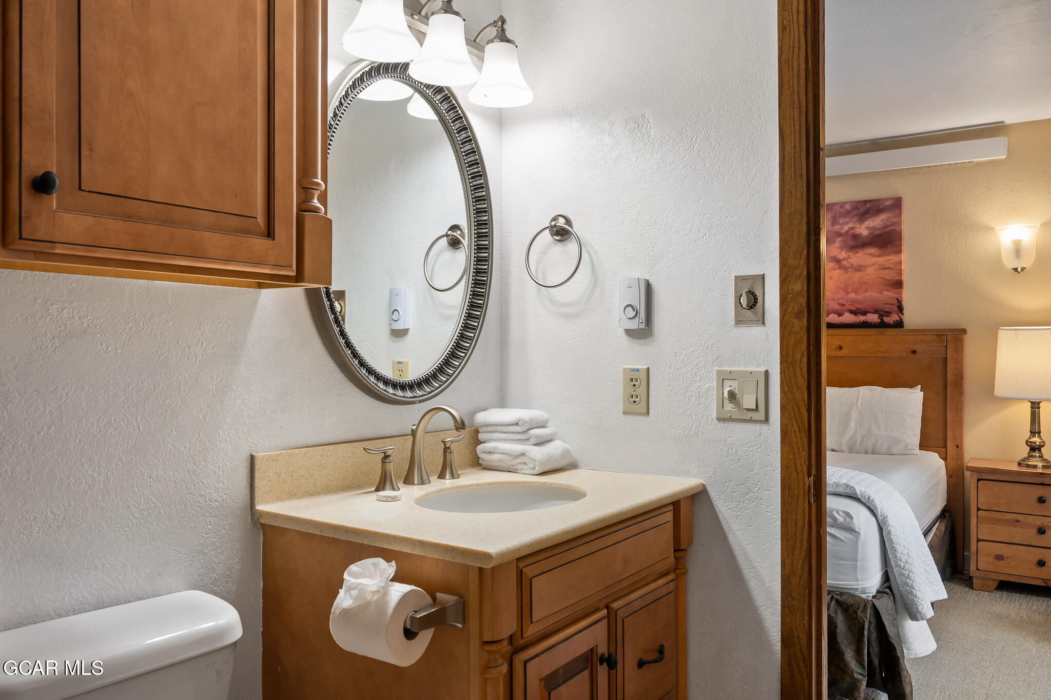 490 Kings Crossing Road, Unit 611 Winter Park, CO 80482 - Photo 25 of 39 a bathroom with a sink vanity mirror and toilet