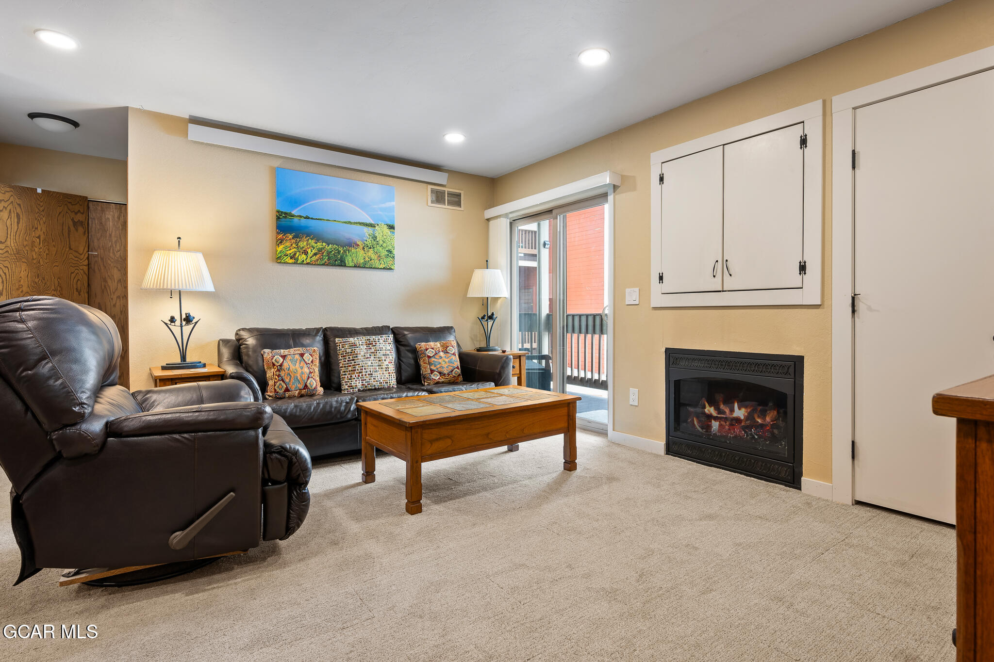 490 Kings Crossing Road, Unit 611 Winter Park, CO 80482 - Photo 9 of 39 a living room with furniture and a fireplace