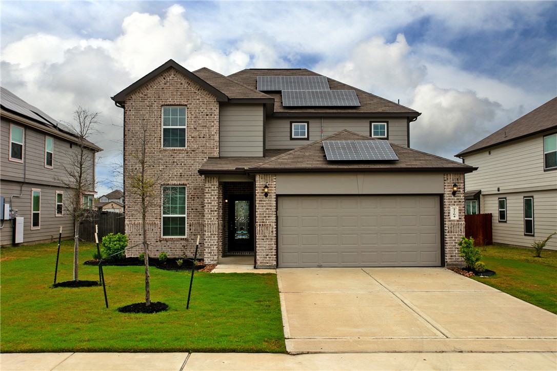 Front elevation. The brick and paint color of the house compliment each other well.