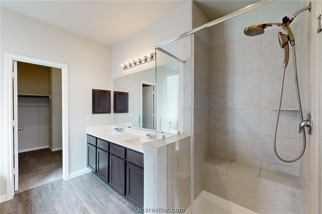 5764 Paseo Place Bryan, TX 77807 - Photo 13 of 35 Enjoy the bench seat in the stand up shower!