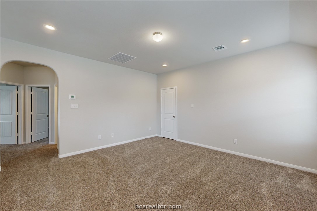 5764 Paseo Place Bryan, TX 77807 - Photo 20 of 35 Large additional living or flex room as you enter the 2nd story from the top of the stairs. Super convenient access into the attic via the walk through door on the right.