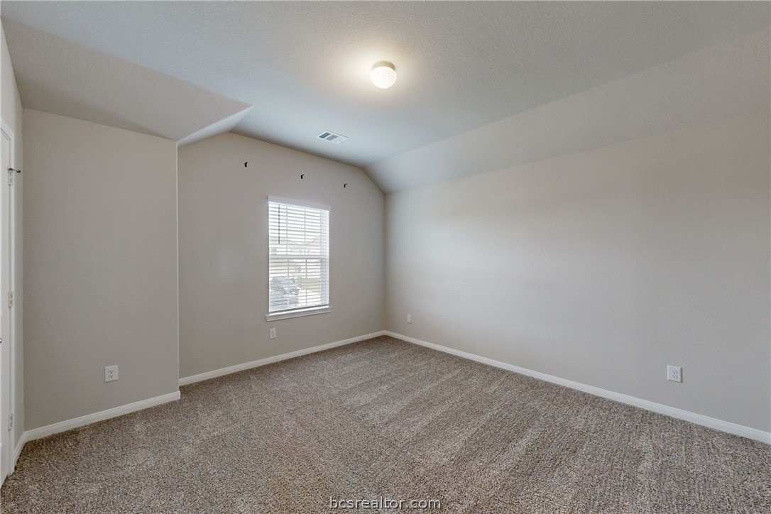 5764 Paseo Place Bryan, TX 77807 - Photo 22 of 35 Large secondary bedroom on the left side of the second story.