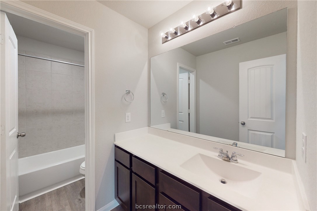 5764 Paseo Place Bryan, TX 77807 - Photo 24 of 35 Secondary bathroom on the second story that is situated in the hallway between the bedrooms and flex room.