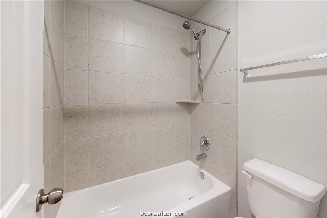 5764 Paseo Place Bryan, TX 77807 - Photo 25 of 35 Tiled shower in the secondary bathroom.