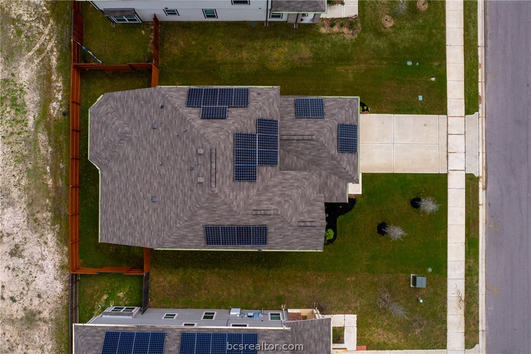 5764 Paseo Place Bryan, TX 77807 - Photo 34 of 35 Aerial view of the solar panel system the home is equipped with.