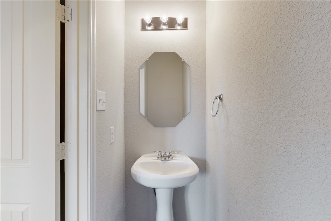 5764 Paseo Place Bryan, TX 77807 - Photo 9 of 35 Pedestal sink in the half bath.