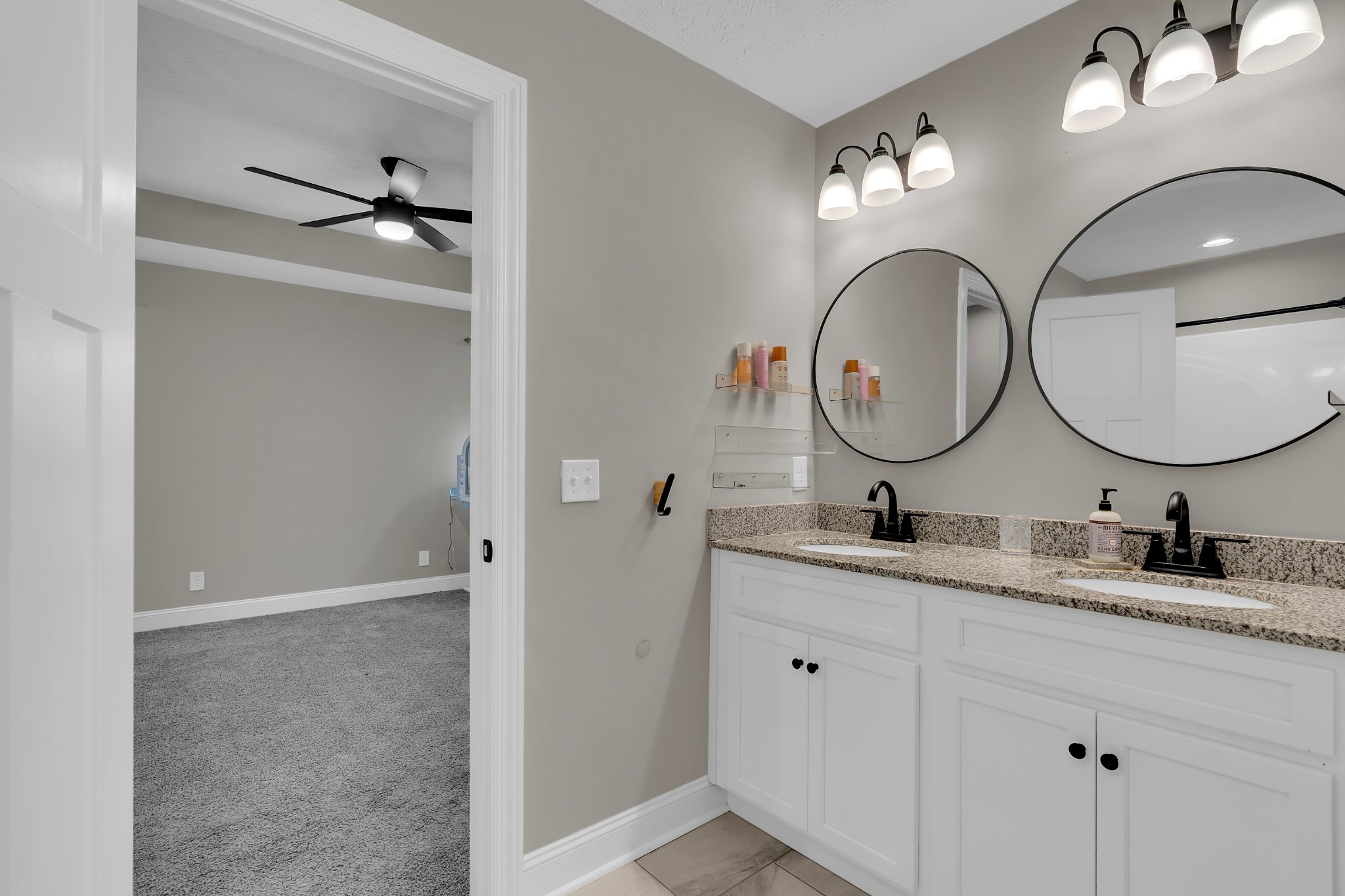 1147 Mt Herman Road Fayetteville, TN 37334 - Photo 11 of 31 a bathroom with a double vanity sink and a mirror