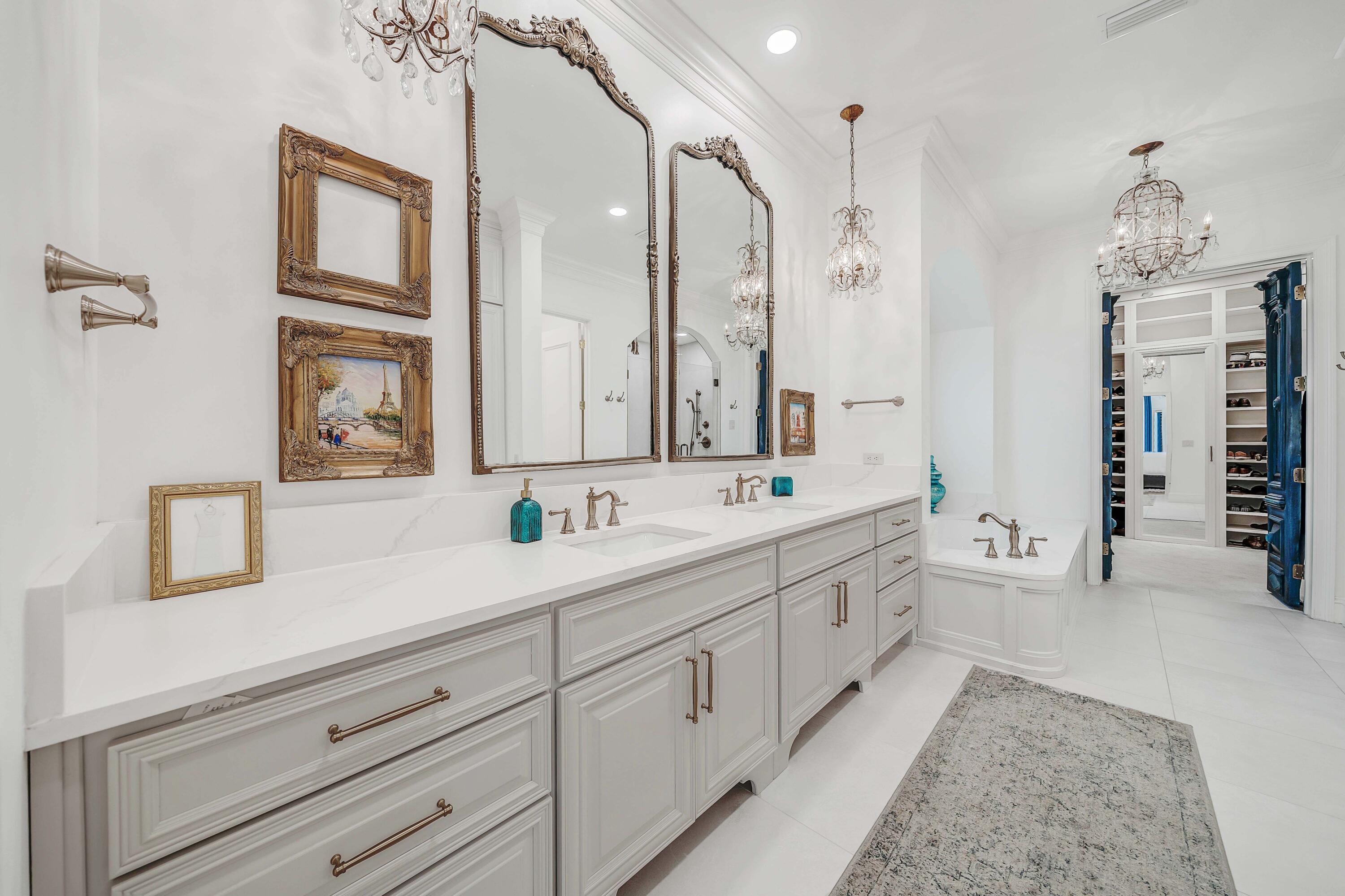 3417 Dragon's Ridge Road Panama City Beach, FL 32408 - Photo 34 of 69 a spacious bathroom with double vanity sink a two mirror a window and a bathtub