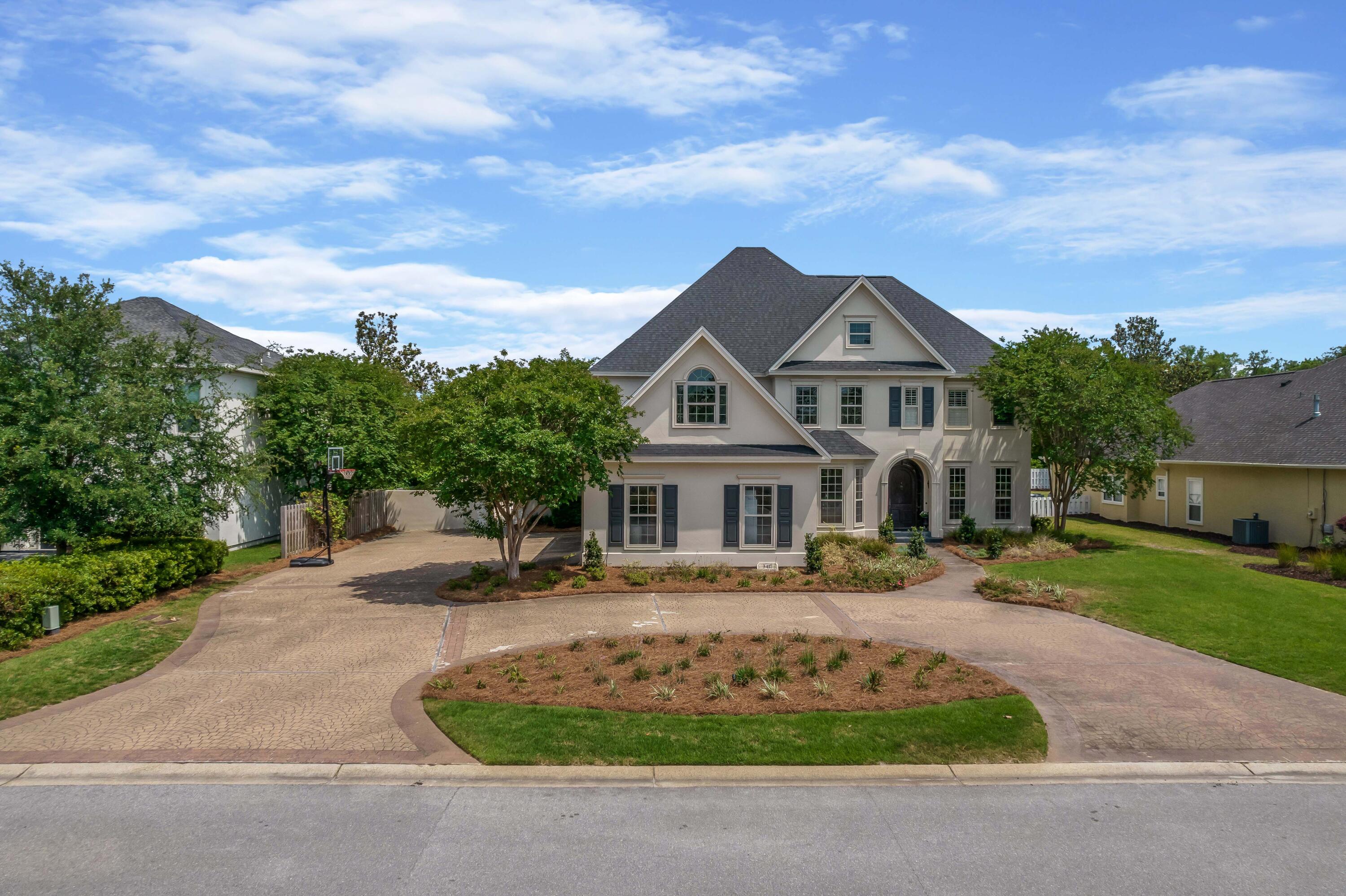 3417 Dragon's Ridge Road Panama City Beach, FL 32408 - Photo 4 of 69 front view of a house with a yard