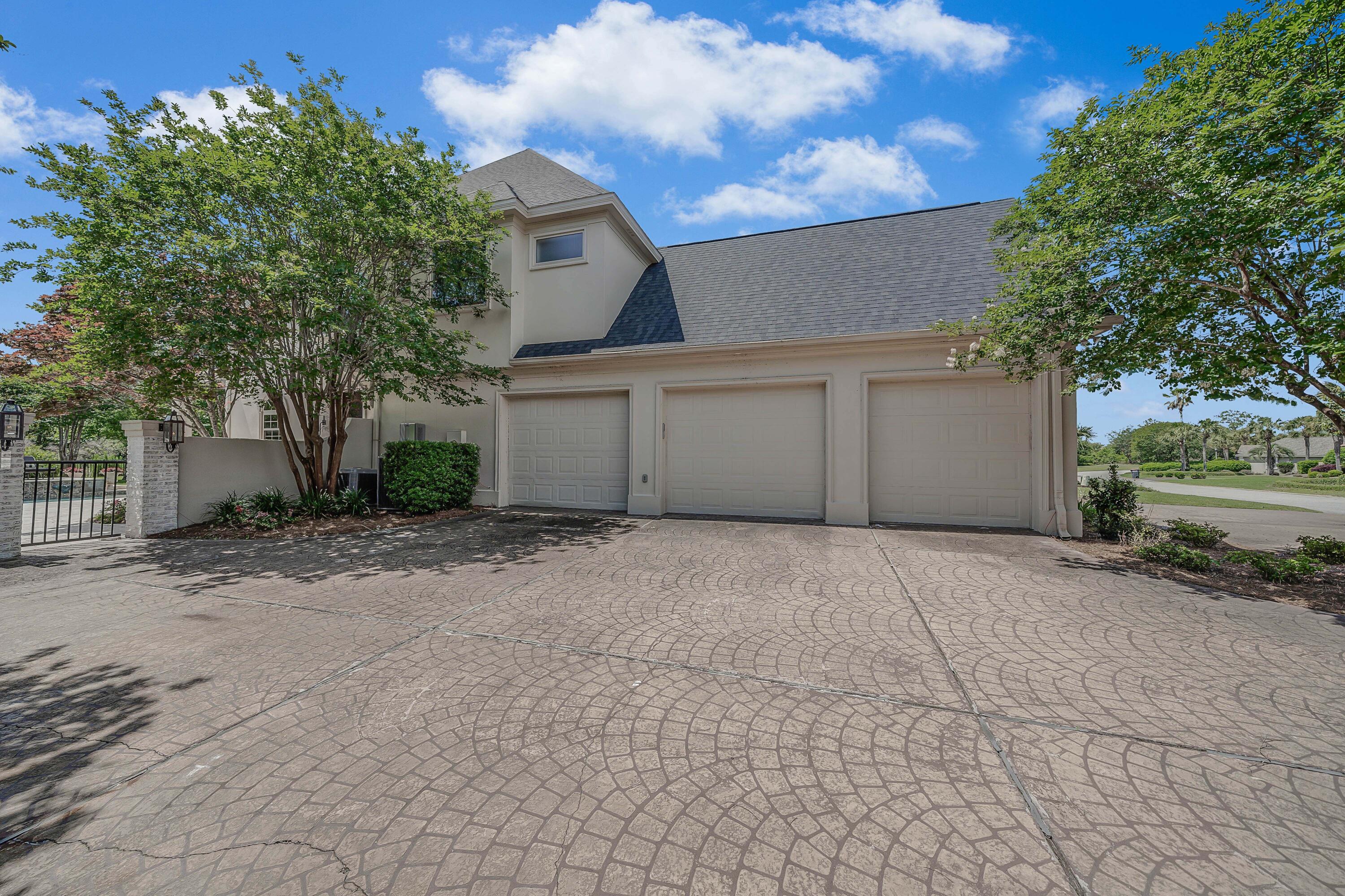 3417 Dragon's Ridge Road Panama City Beach, FL 32408 - Photo 5 of 69 a house with a yard and garage