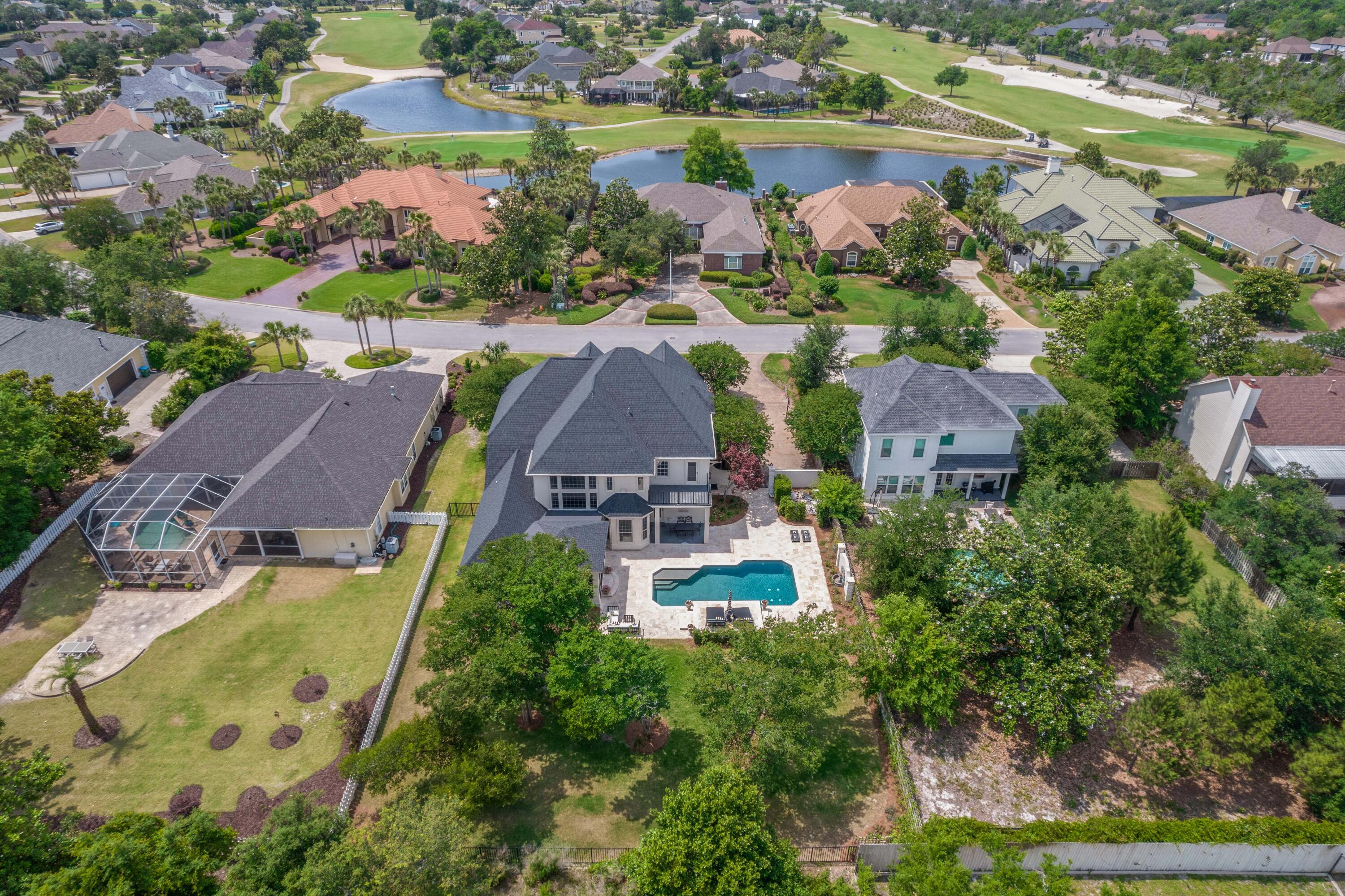 3417 Dragon's Ridge Road Panama City Beach, FL 32408 - Photo 65 of 69 an aerial view of residential houses with outdoor space and swimming pool