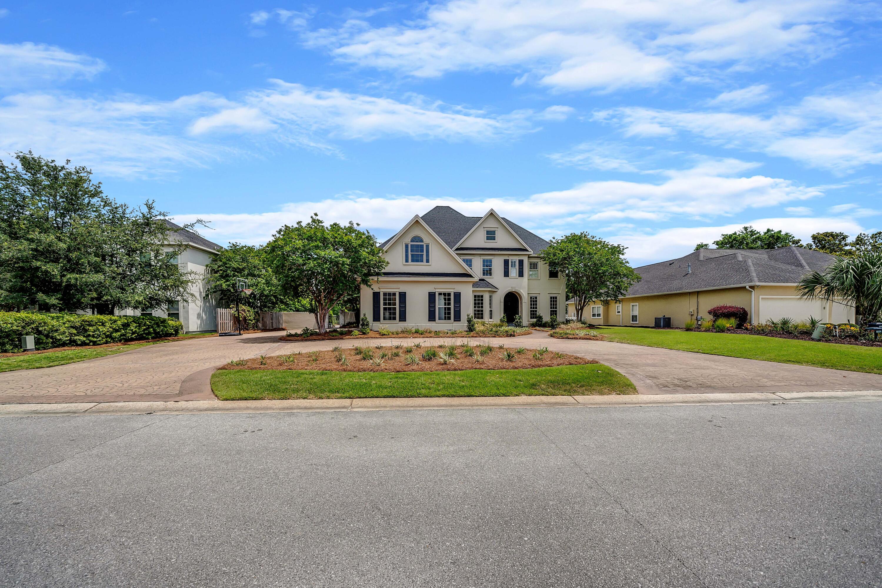 3417 Dragon's Ridge Road Panama City Beach, FL 32408 - Photo 67 of 69 a view of house with a big yard and large trees