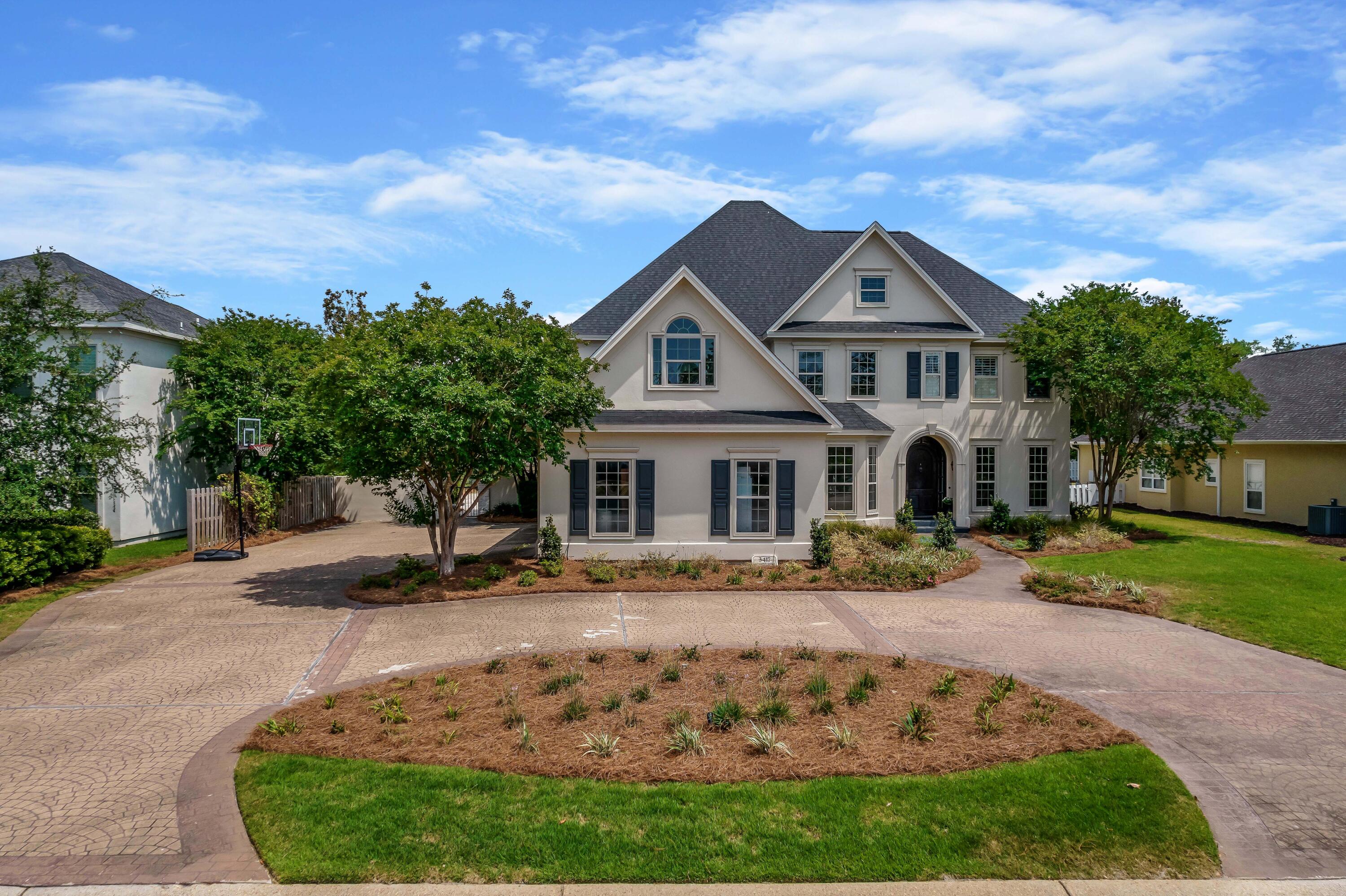 3417 Dragon's Ridge Road Panama City Beach, FL 32408 - Photo 69 of 69 a front view of a house with garden
