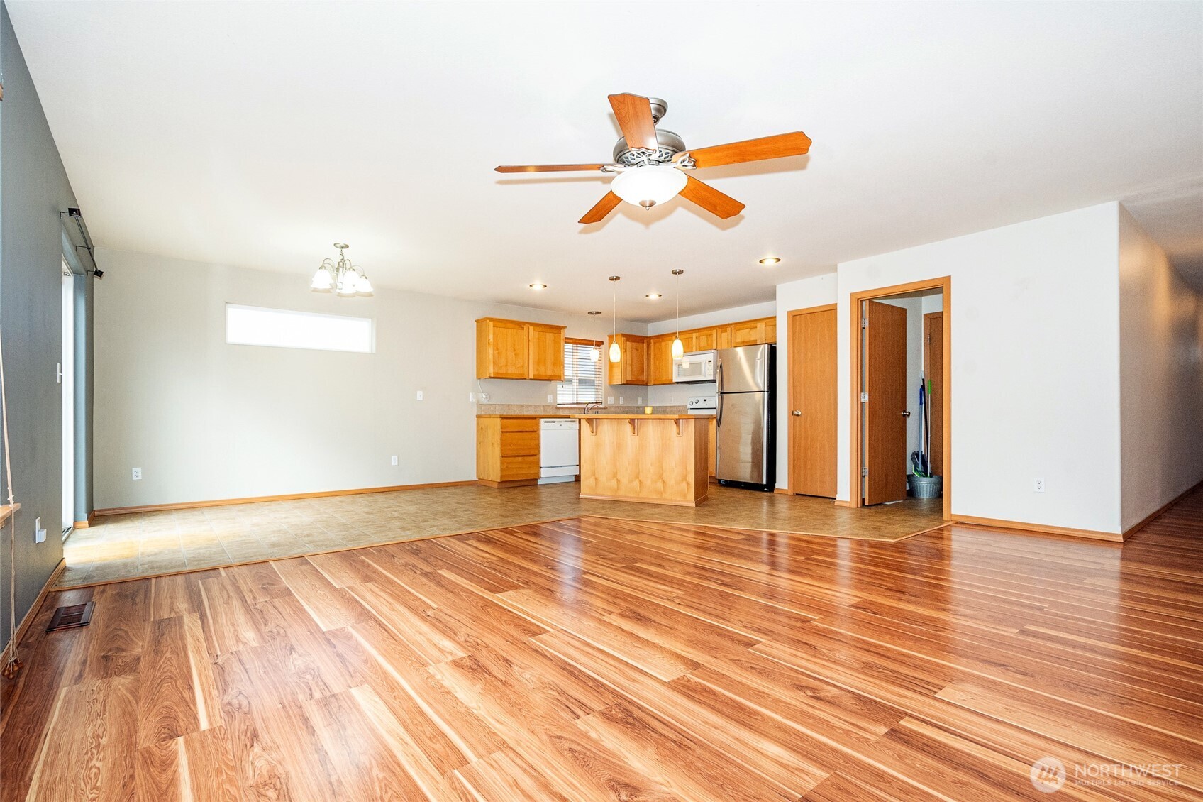 241 Parkside Loop Napavine, WA 98532 - Photo 11 of 34 a view of an empty room with wooden floor and a window