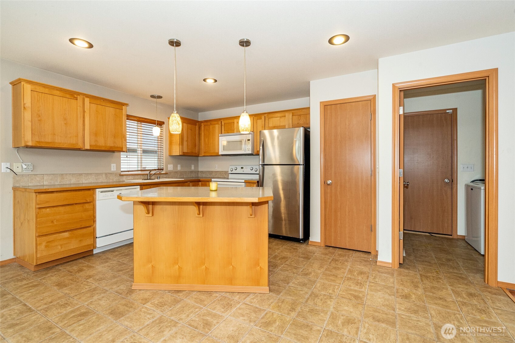 241 Parkside Loop Napavine, WA 98532 - Photo 13 of 34 a kitchen with stainless steel appliances granite countertop a refrigerator and a stove