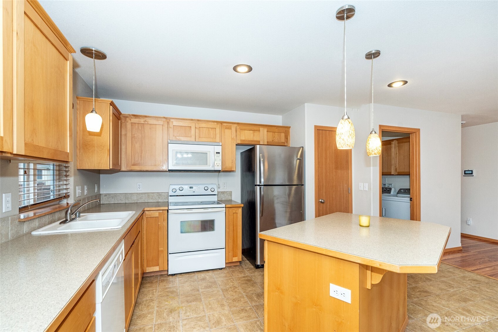 241 Parkside Loop Napavine, WA 98532 - Photo 15 of 34 a kitchen with refrigerator and cabinets