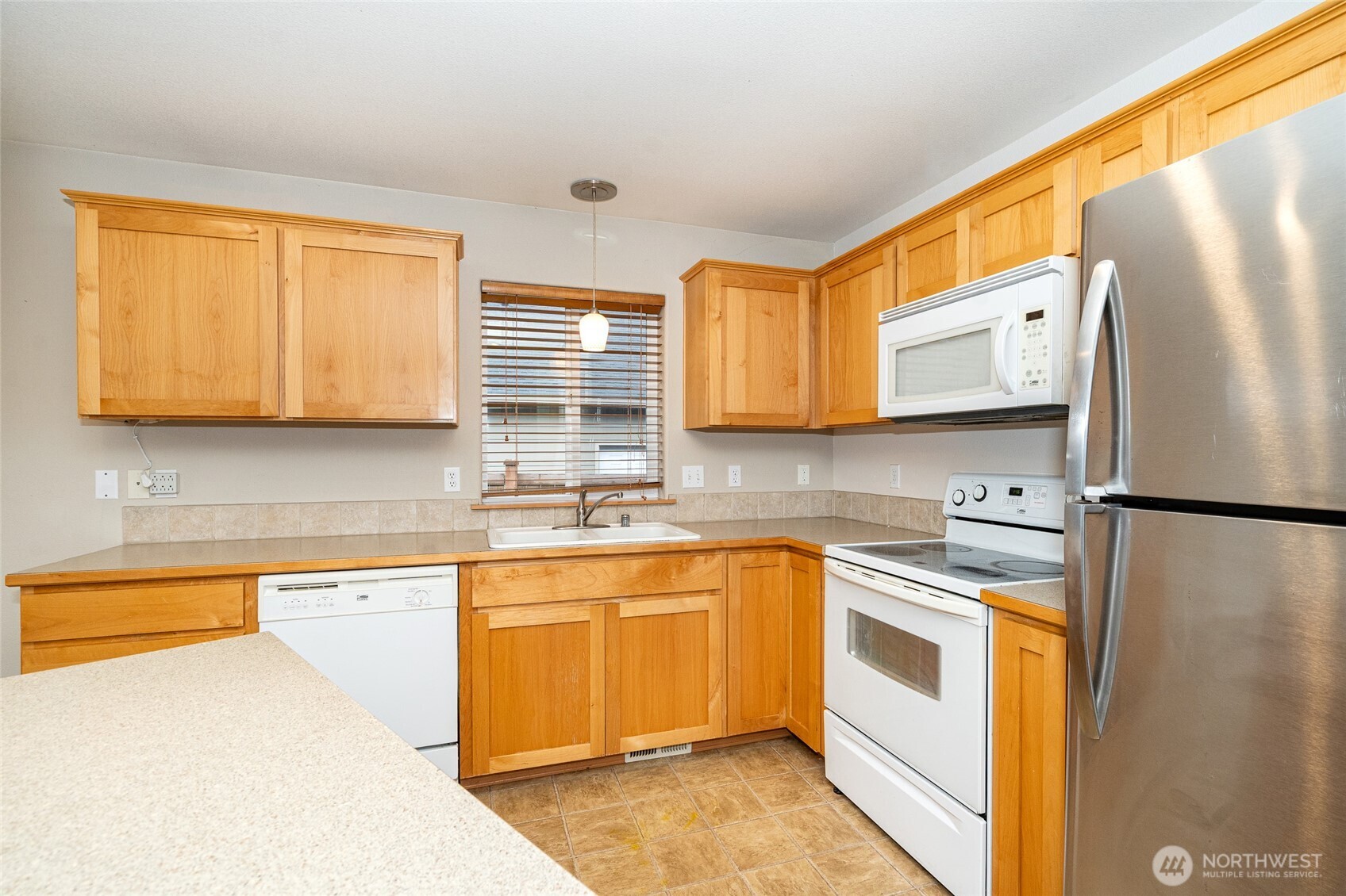 241 Parkside Loop Napavine, WA 98532 - Photo 16 of 34 a kitchen with stainless steel appliances granite countertop a refrigerator sink stove microwave and cabinets