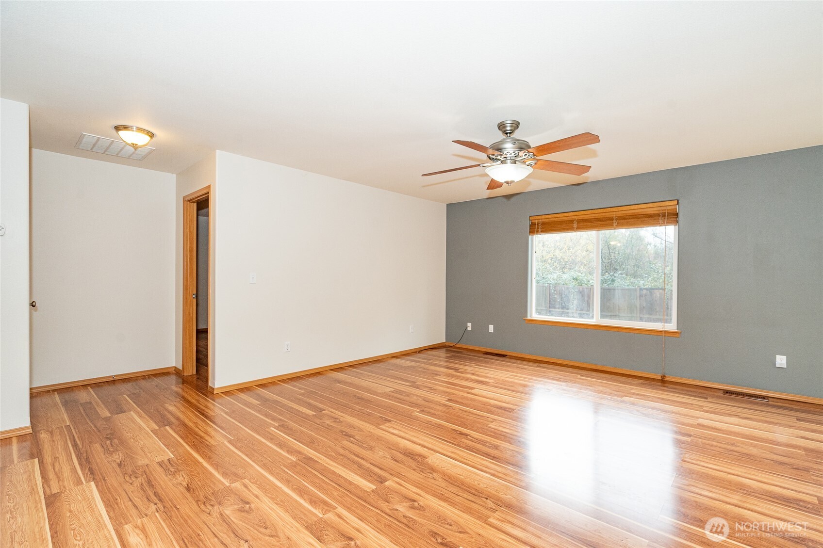 241 Parkside Loop Napavine, WA 98532 - Photo 17 of 34 a view of an empty room with wooden floor and a window