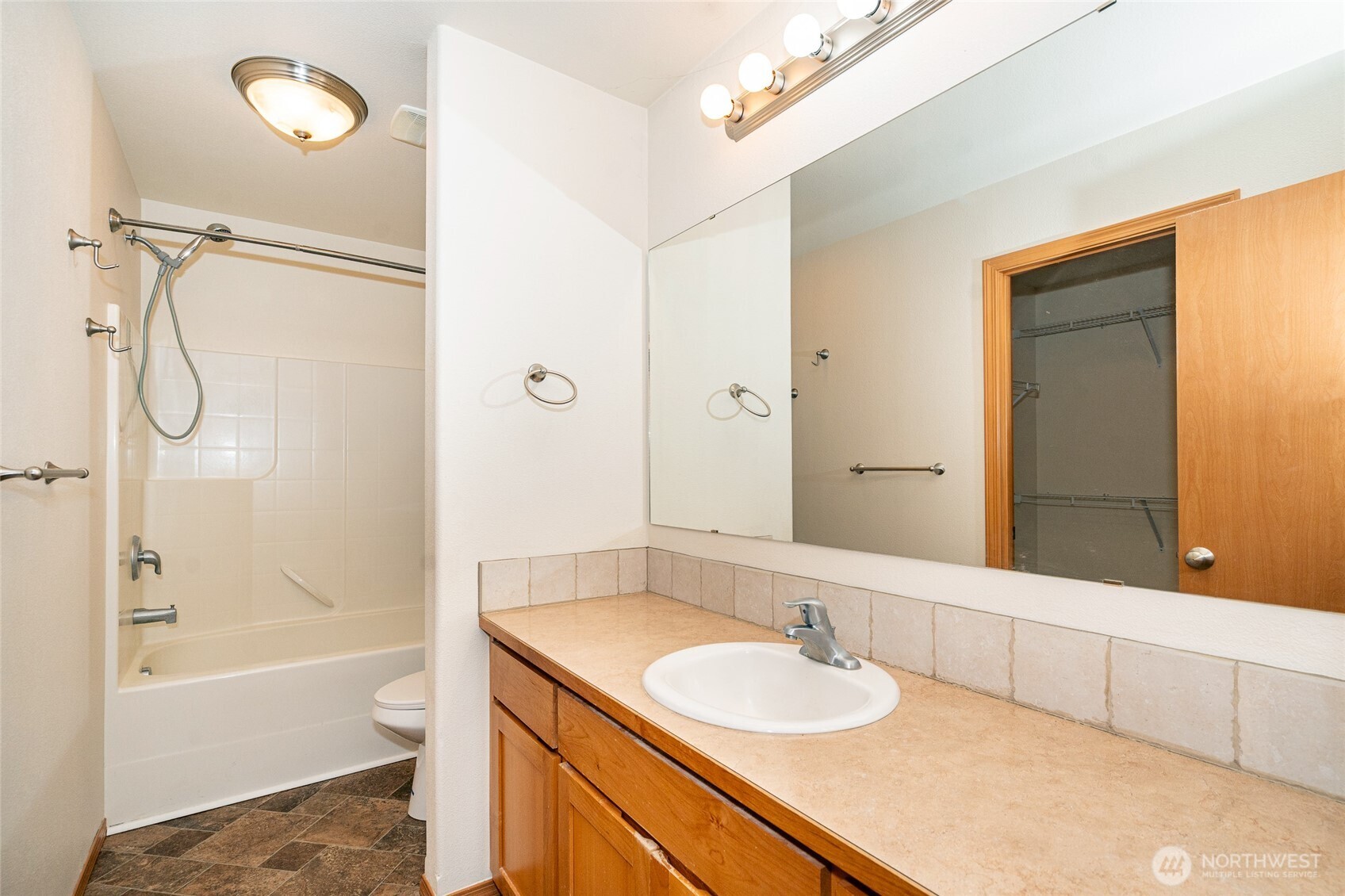 241 Parkside Loop Napavine, WA 98532 - Photo 25 of 34 a bathroom with a granite countertop sink and a mirror