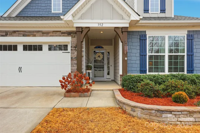 a view of a patio with table and chairs and potted plants