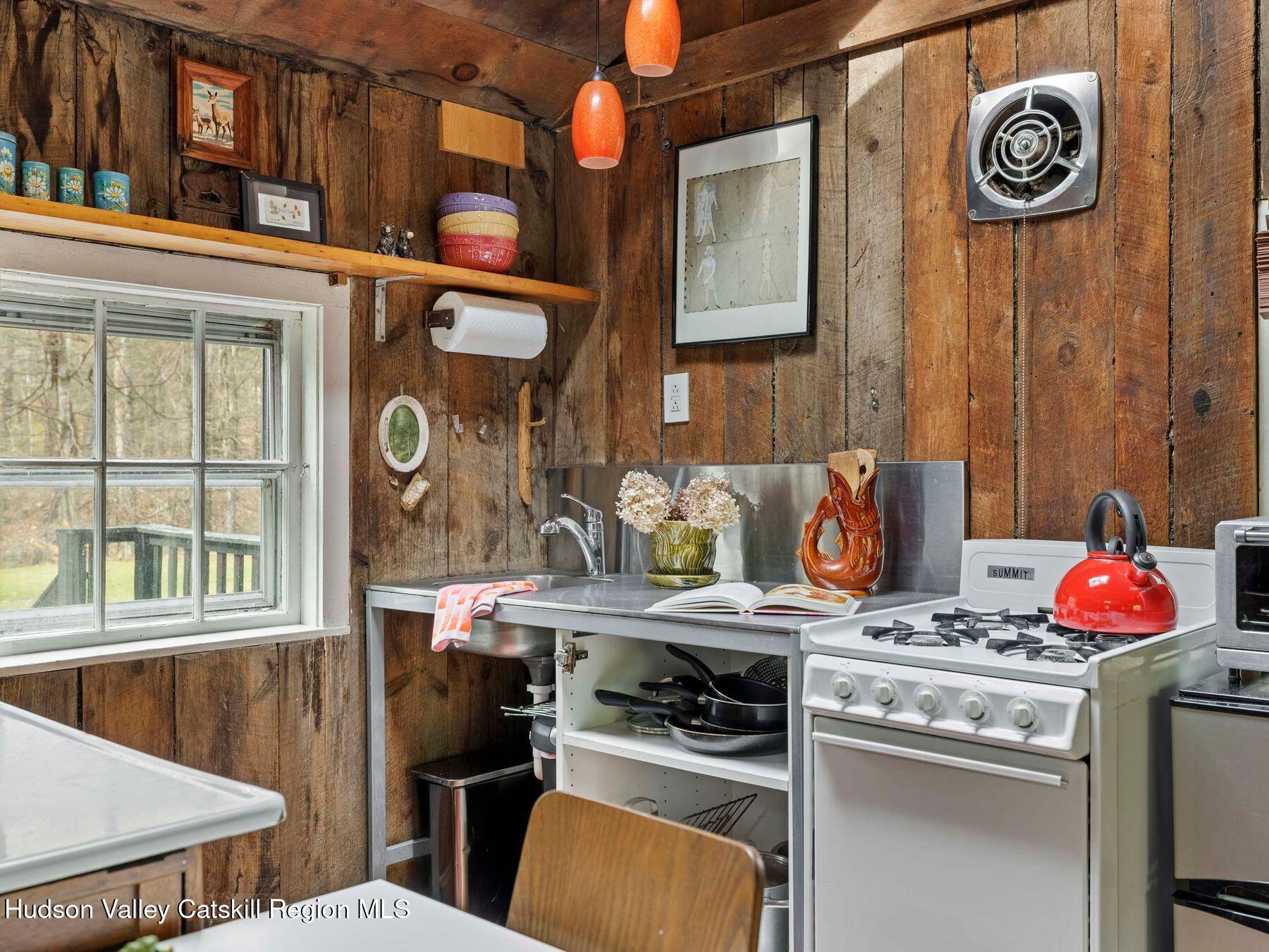 259 Silver Hollow Road Willow, NY 12495 - Photo 16 of 28 a kitchen with stainless steel appliances granite countertop a stove and a sink