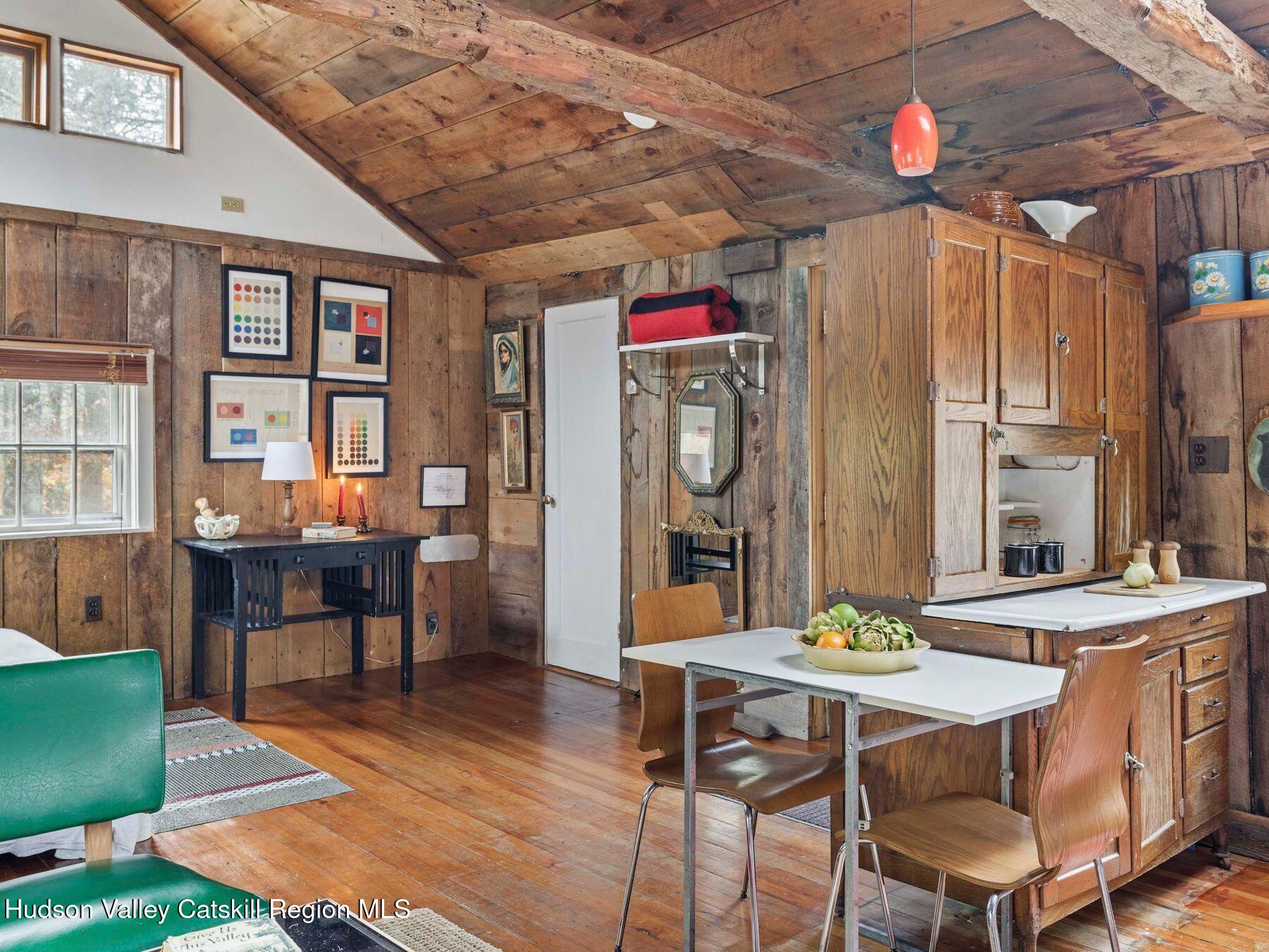 259 Silver Hollow Road Willow, NY 12495 - Photo 18 of 28 a view of a dining room with furniture and a chandelier