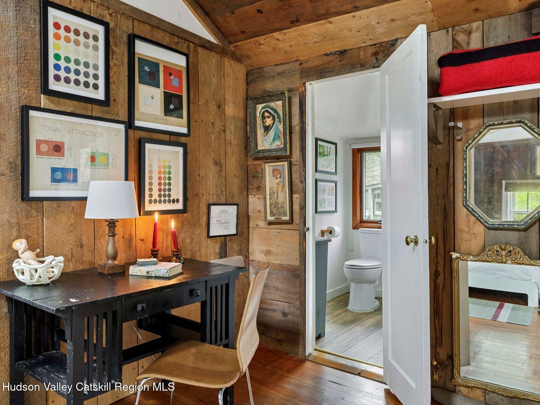 259 Silver Hollow Road Willow, NY 12495 - Photo 22 of 28 a view of a dining room with furniture and a chandelier