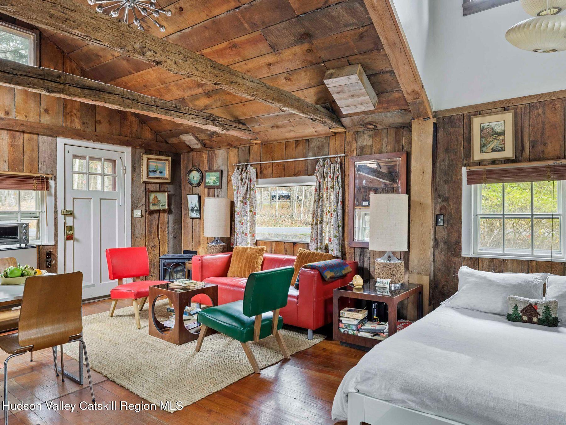 259 Silver Hollow Road Willow, NY 12495 - Photo 5 of 28 a bedroom with furniture and a large window