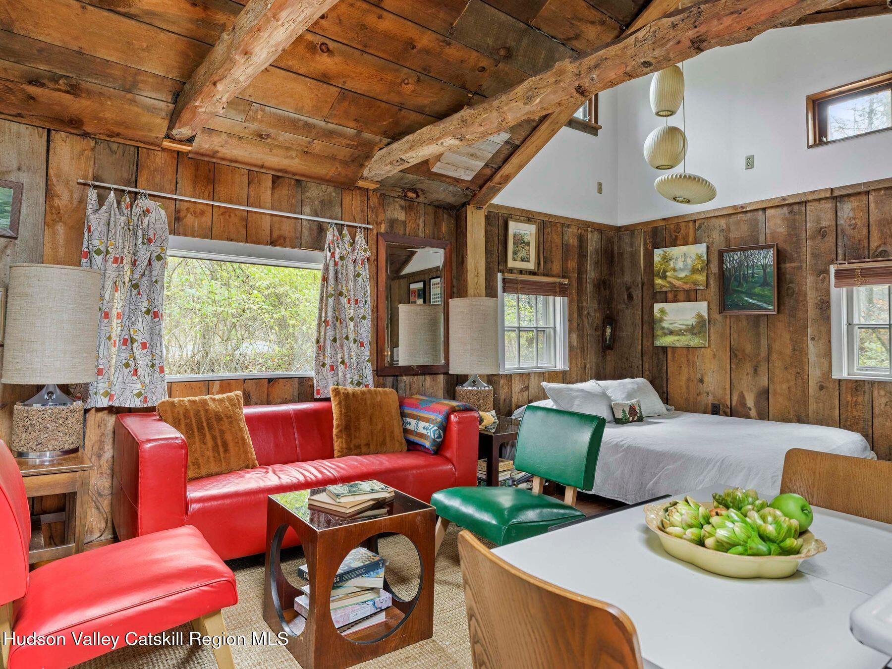 259 Silver Hollow Road Willow, NY 12495 - Photo 7 of 28 a living room with furniture and a large window