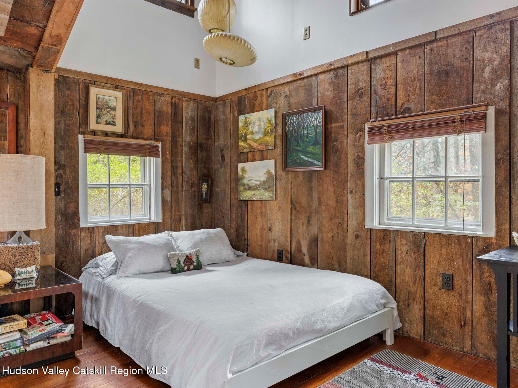 259 Silver Hollow Road Willow, NY 12495 - Photo 10 of 28 a bedroom with a large bed and a window