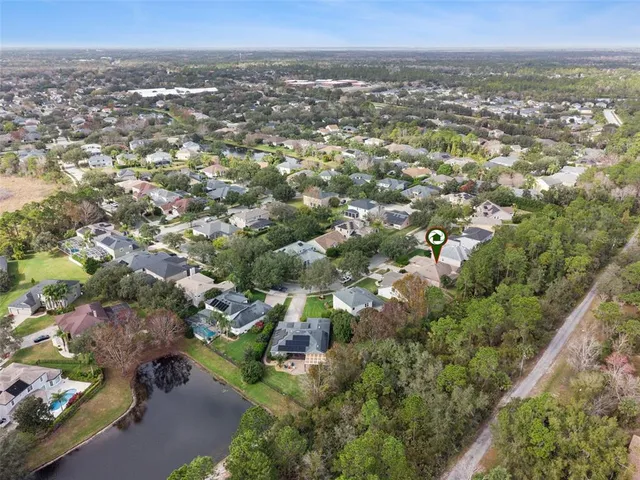 an aerial view of a house with a garden
