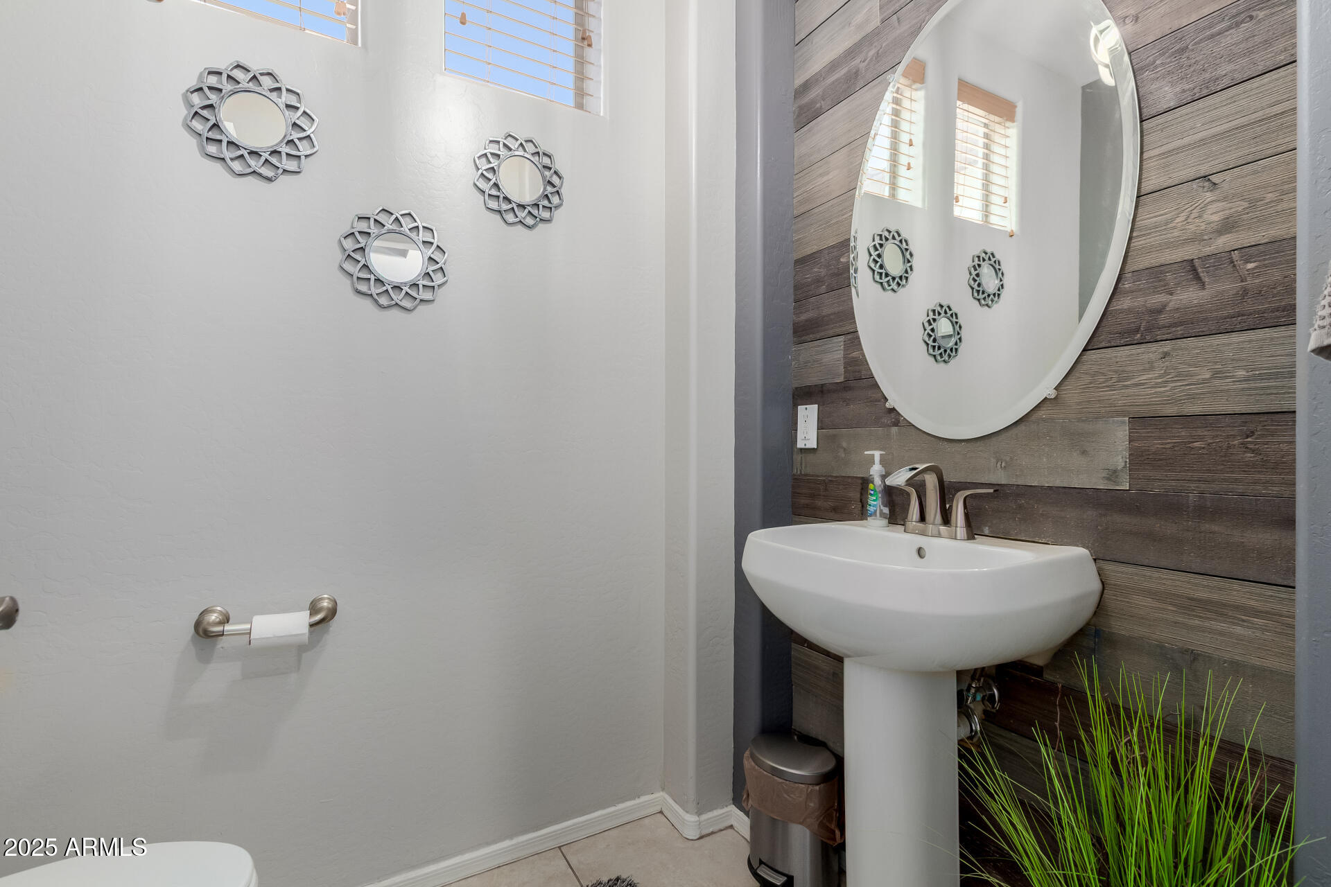 45247 West Jack Rabbit Trail Maricopa, AZ 85139 - Photo 15 of 46 a bathroom with a sink and mirror
