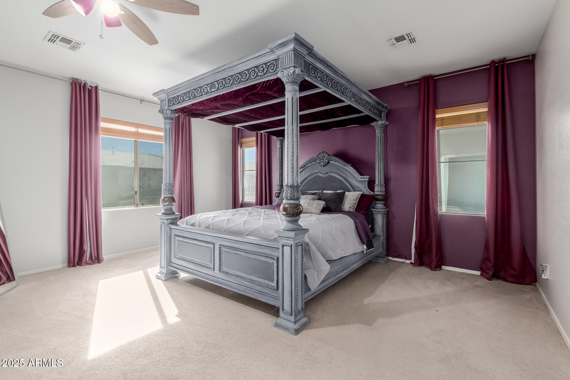 45247 West Jack Rabbit Trail Maricopa, AZ 85139 - Photo 16 of 46 a bed sitting in a room next to a window