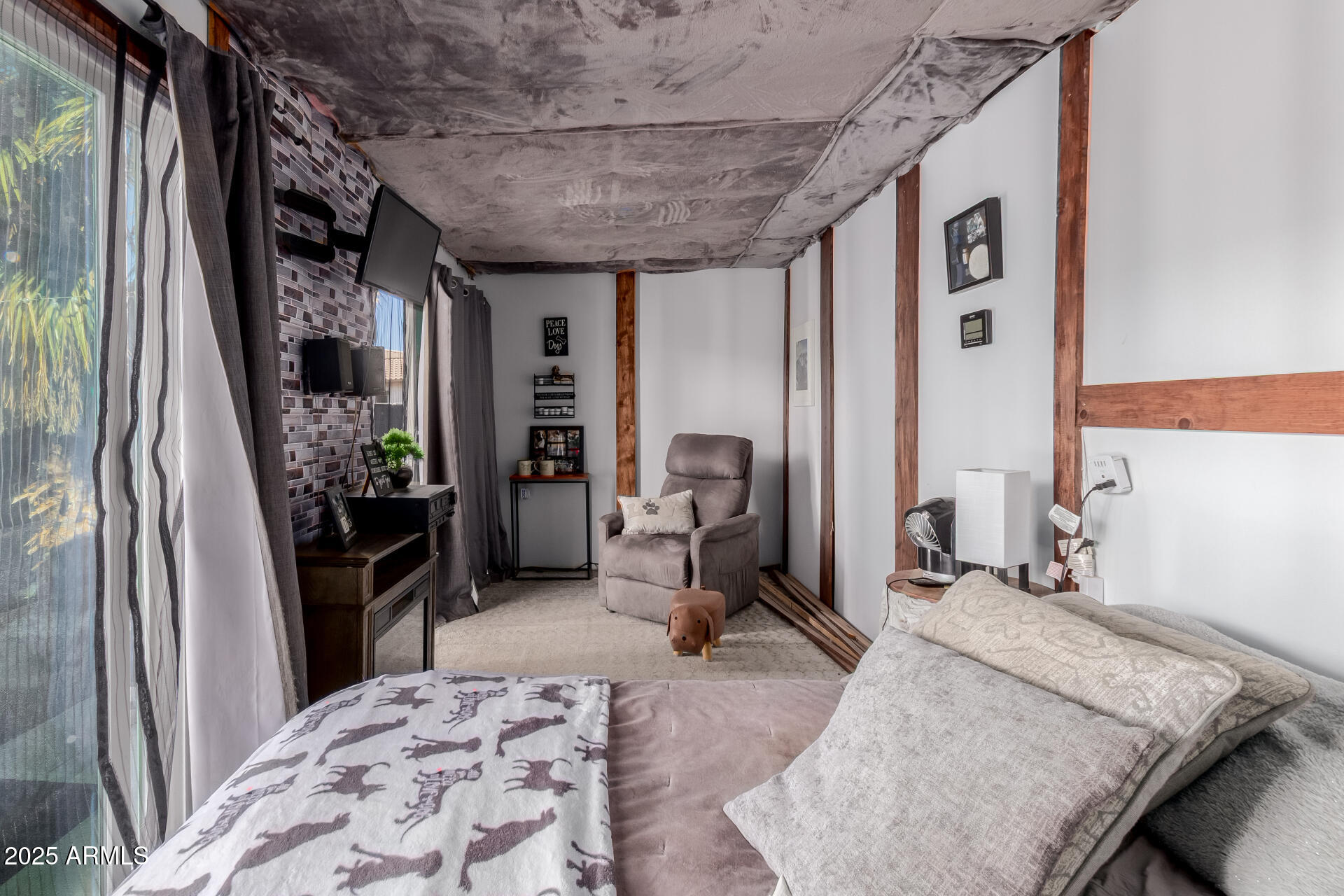 45247 West Jack Rabbit Trail Maricopa, AZ 85139 - Photo 37 of 46 a bedroom with furniture and a flat screen tv