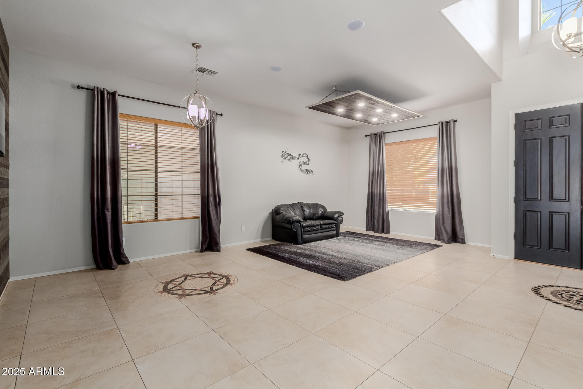 45247 West Jack Rabbit Trail Maricopa, AZ 85139 - Photo 4 of 46 a bedroom with a bed and a window