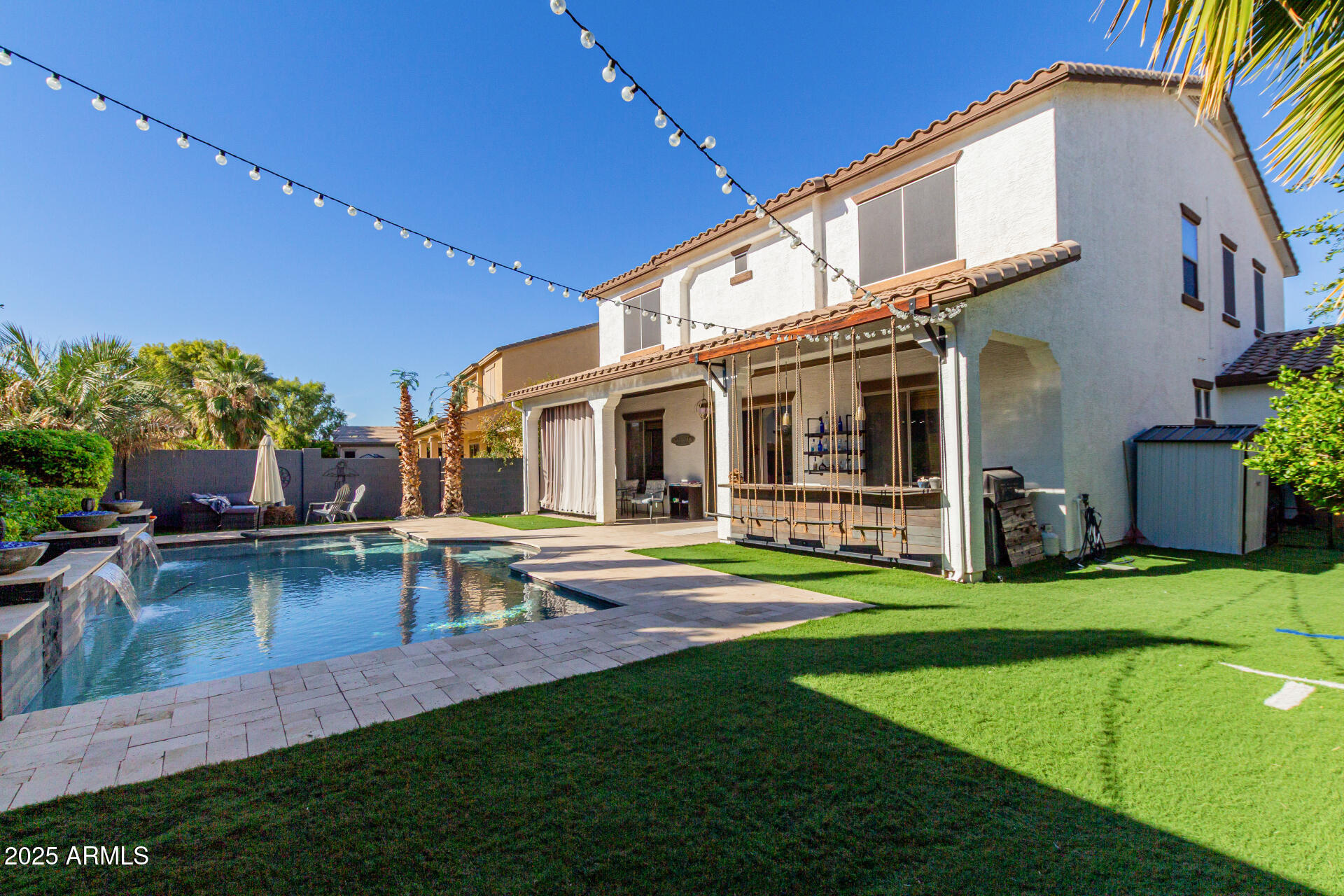 45247 West Jack Rabbit Trail Maricopa, AZ 85139 - Photo 42 of 46 a view of a house with swimming pool and sitting area