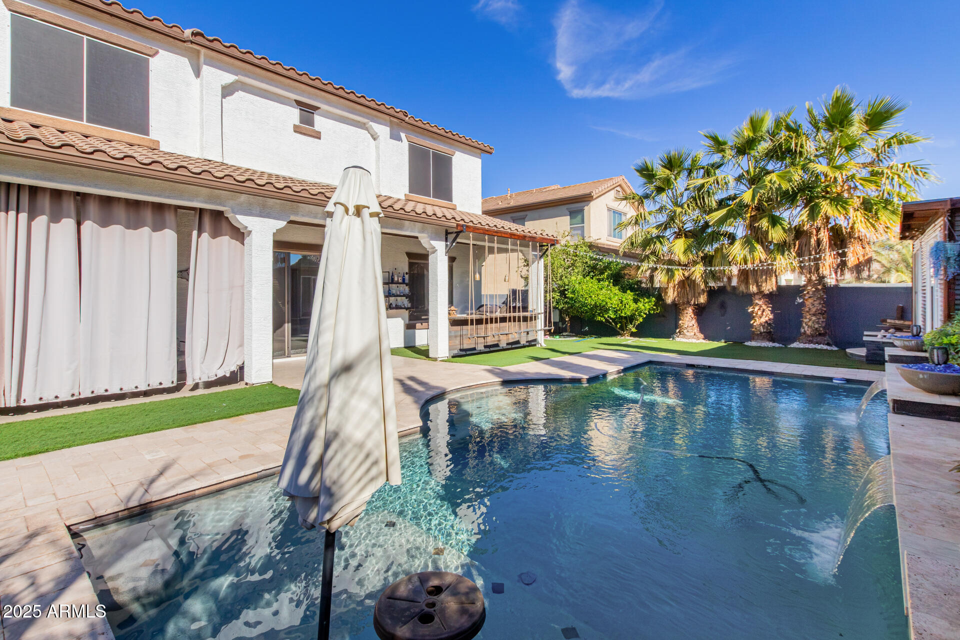 45247 West Jack Rabbit Trail Maricopa, AZ 85139 - Photo 44 of 46 a view of a swimming pool with a patio