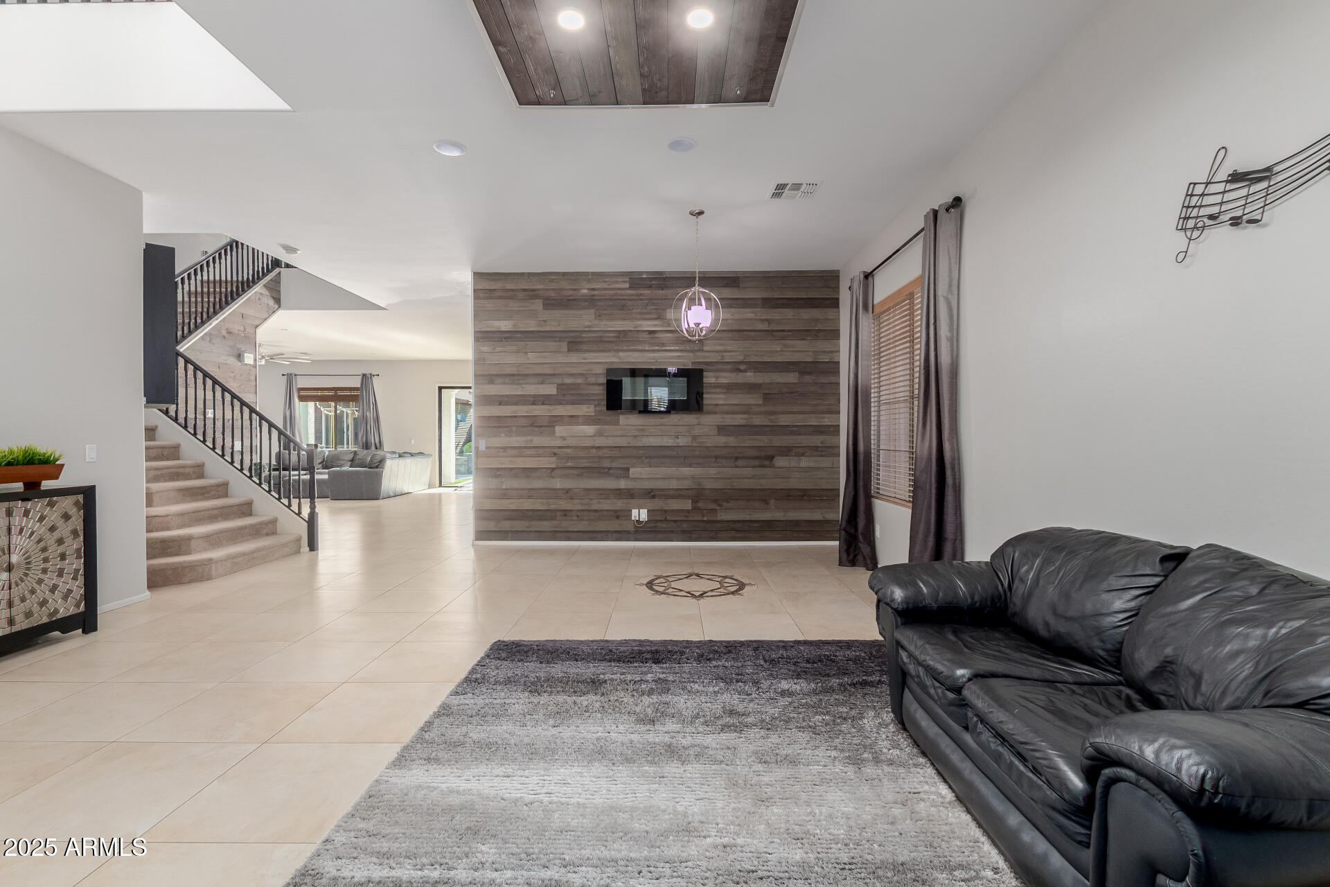 45247 West Jack Rabbit Trail Maricopa, AZ 85139 - Photo 6 of 46 a living room with furniture and stairs