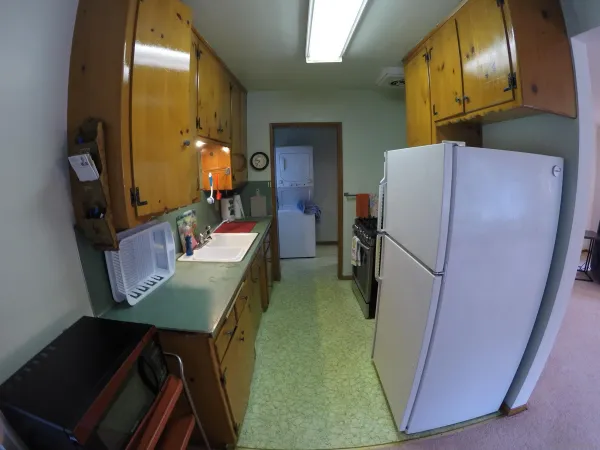 a dining room with furniture and a mirror