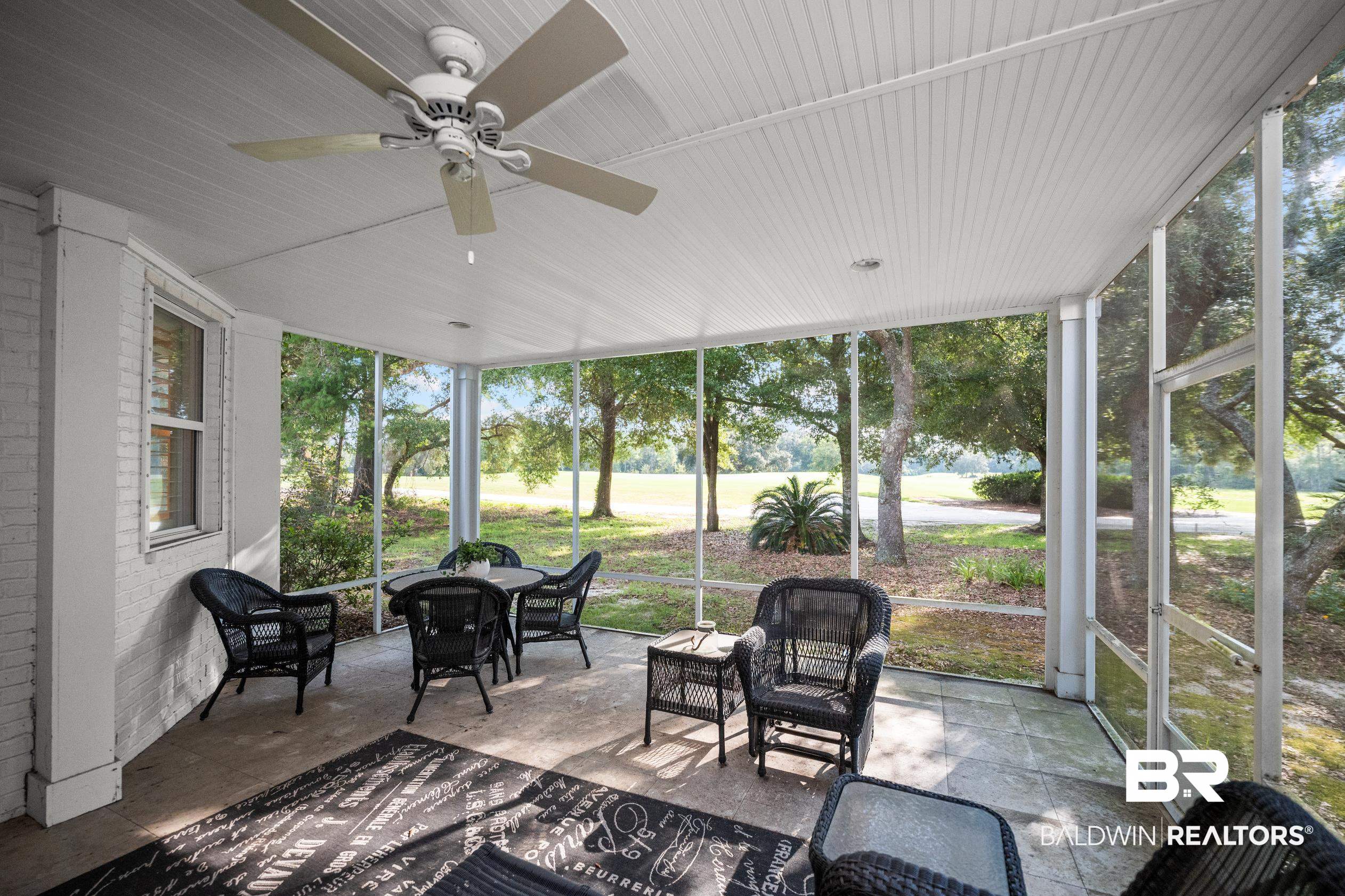 404 Peninsula Boulevard Gulf Shores, AL 36542 - Photo 33 of 51 Sunroom featuring a ceiling fan and plenty of natural light