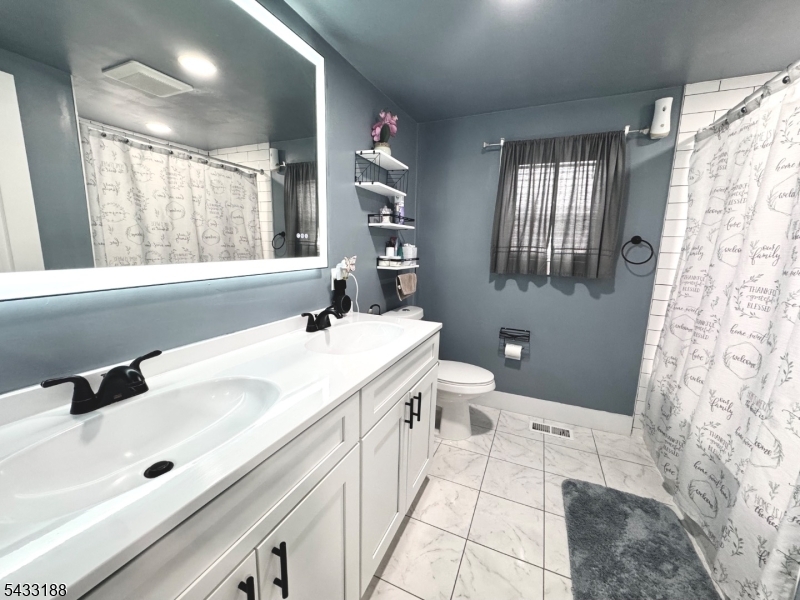 13 Highway 46 Columbia, NJ 07832 - Photo 12 of 22 a spacious bathroom with a tub sink and mirror